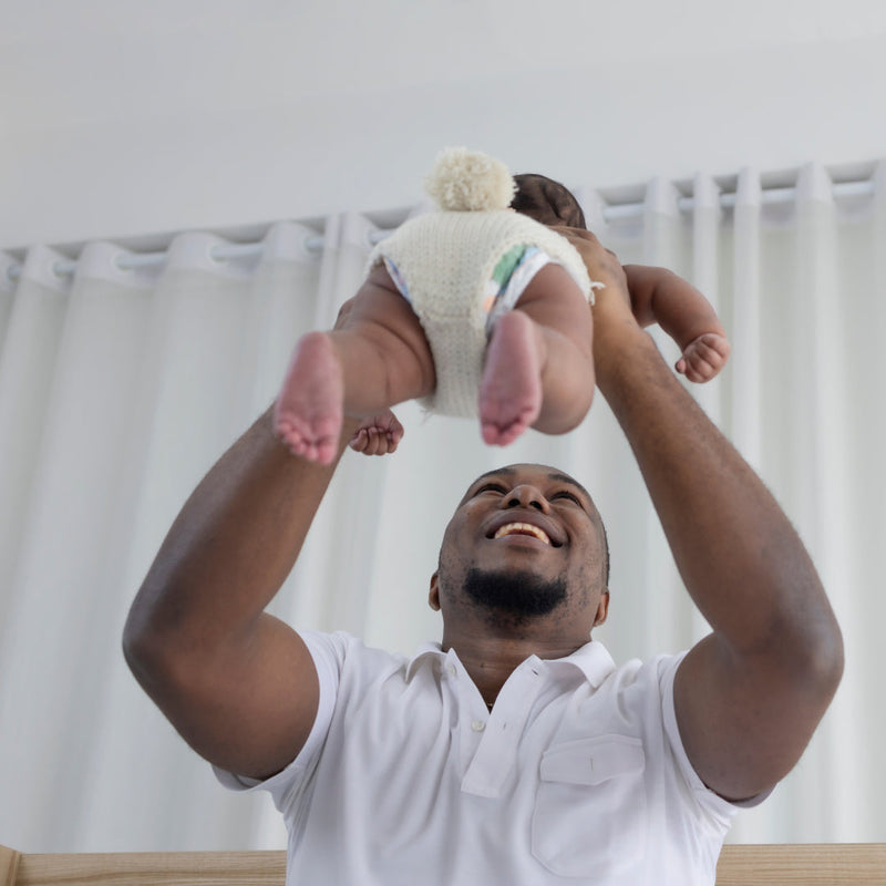 Father playing with his baby