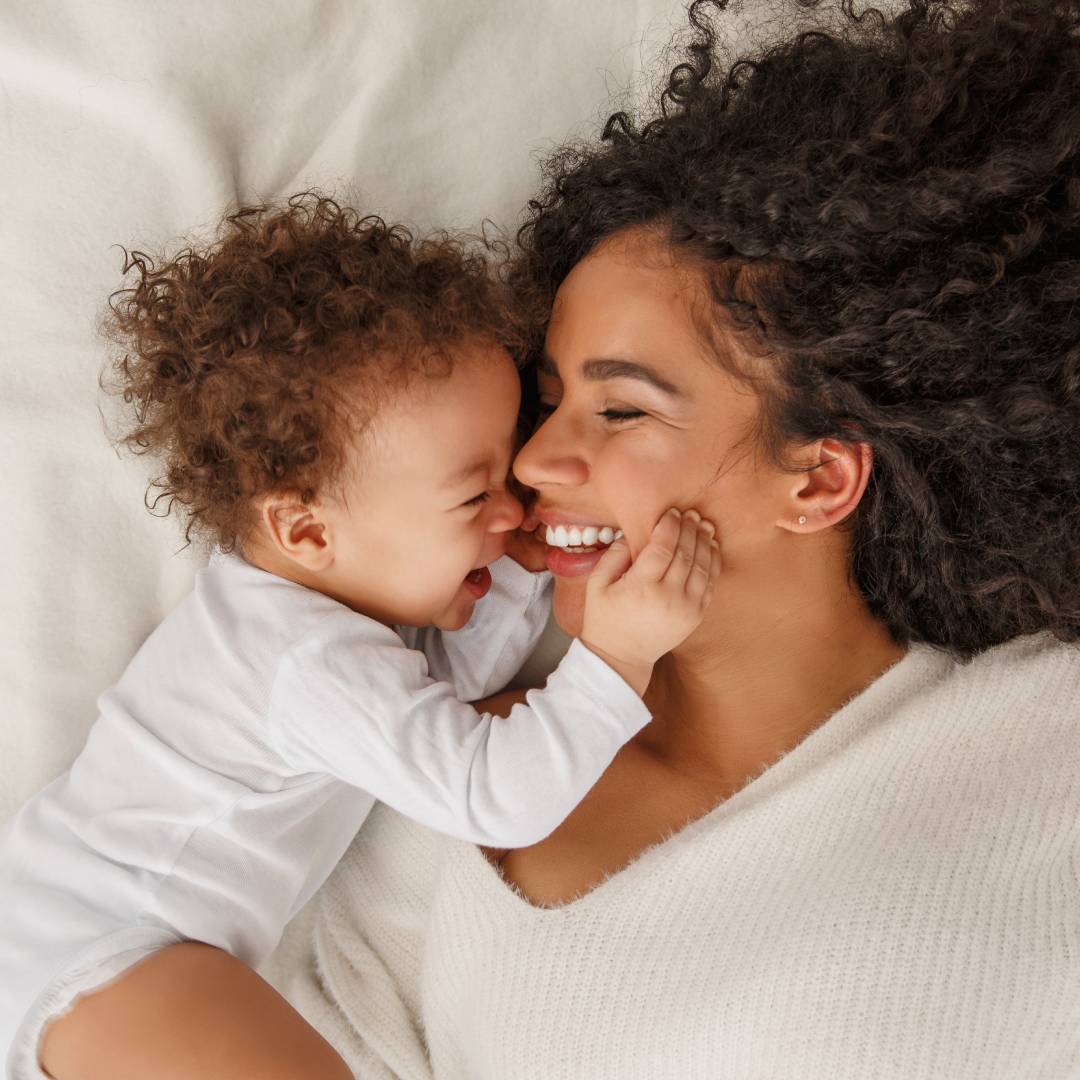 Happy smiling mother and baby