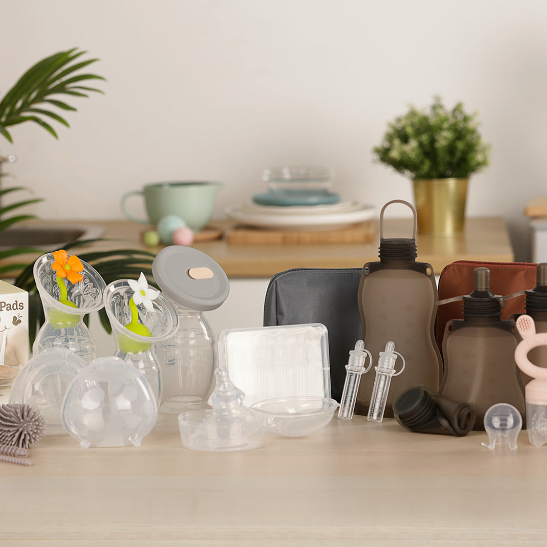 An image of Haakaa products, including breast pumps, milk storage bags, and colostrum collectors.